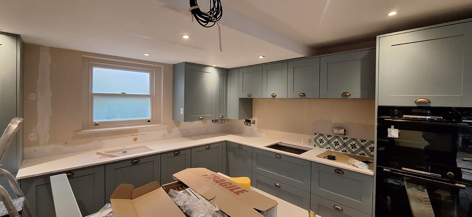A finished shaker kitchen by Dehari Construction in Chandler's Ford